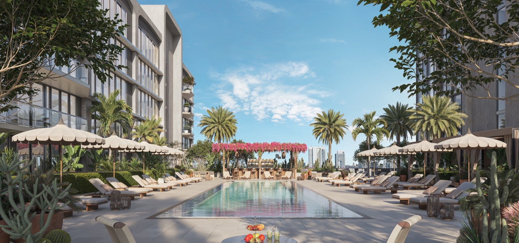 Resort-style pool with shaded lounges and lush landscaping.